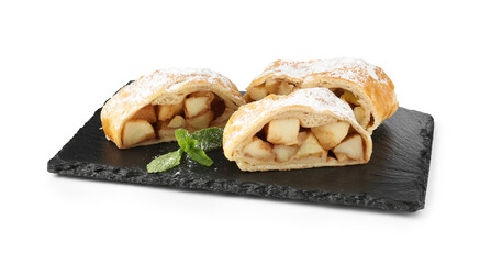 Pieces of tasty apple strudel with powdered sugar and mint isolated on white