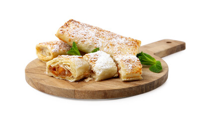 Tasty apple strudels with powdered sugar and mint isolated on white