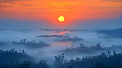 Fototapeta premium Sunrise over misty tropical forest.