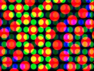 Overlapping circles in vibrant colors—red, yellow, green, blue, pink—create a dynamic pattern against a black background.