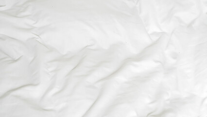 Obraz premium White bedding with soft folds and neutral tones for cozy interior aesthetics.