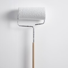 Obraz premium White paint roller against a white wall