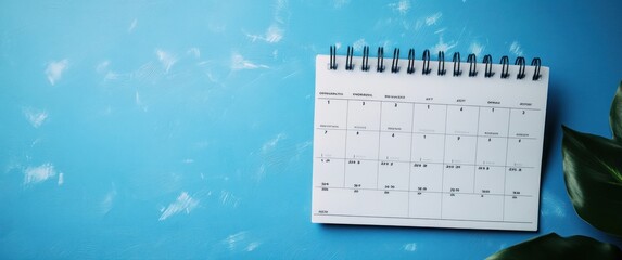 Calendar Appointment Schedule Organizer for Business Meetings Travel Planning with Red Pins on Desk