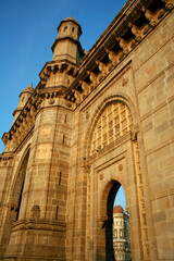 India, Mumbai, Gateway of India with Taj Mahal Palace hotel in the background through the archway. 