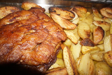 Close-up of pork with potatoes in the oven - Mediterranean diet, greek cuisine, cretan hospitality