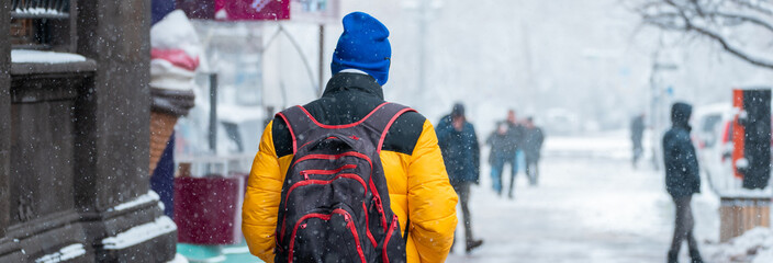 City Residents Walking Outside in Cold Winter Weather