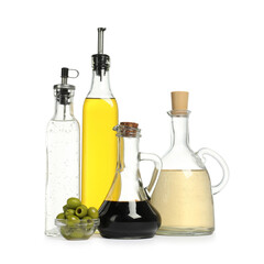 Salad dressings and olives isolated on white