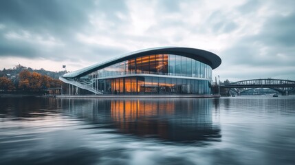 Obraz premium Modern riverside building reflecting, city bridge background, evening