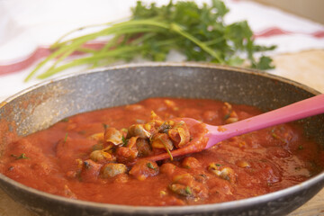 tomato sauce with sea snails
