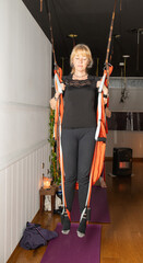 woman doing aerial yoga exercise