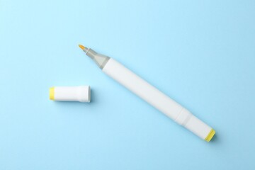 One color double sided marker on light blue background, top view