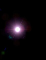 Bright starburst lens flare effect, isolated on black background, radiant, vibrant