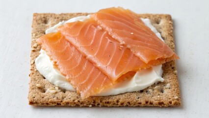 Healthy breakfast protein-rich concept. Smoked salmon slices on cream cheese spread over a crispbread base.