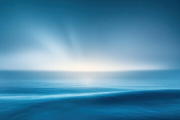Obraz premium Minimalist Abstract Seascape with Soft Gradients and Ethereal Light Beams in Serene Blue Color Palette
