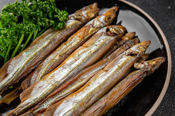 smoked capelin fish sprat vegetables dish fresh delicious gourmet food background on table rustic food top view copy space pescetarian diet