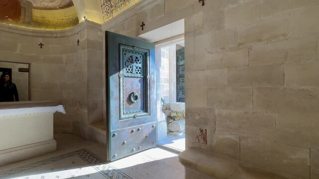 Mount Tabor. A half-open iron door of the Basilica of the Transfiguration on Mount Tabor.