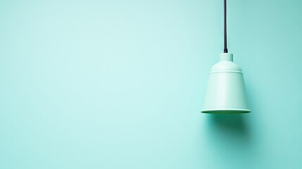Obraz premium Mint green pendant lamp on mint background, minimalist studio shot, use for interior design, home decor