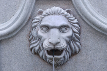 Close up marble of lion head sculpture and fountain with decorative art roman style,ancient with lion head isolated on background