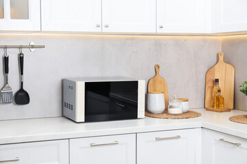 Closed microwave oven on counter in kitchen