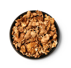 Plate with tasty dried mushrooms on white background