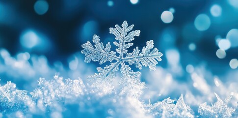 A perfectly formed snowflake resting on a bed of fresh ice crystals