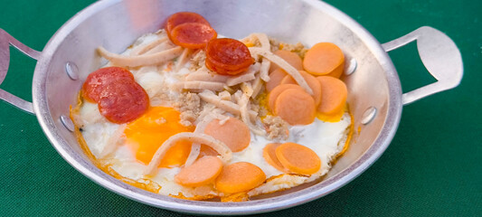 pan-fried egg with pork and toppings. Breakfast food in Thai style