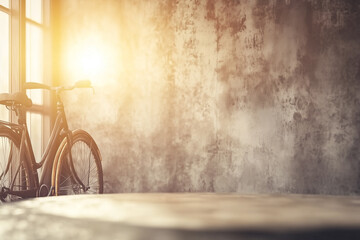 Obraz premium Vintage Bicycle Against Textured Concrete Wall with Warm Light from Window in Modern Setting