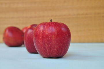 red apple on wooden table