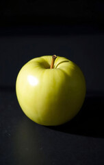 Single Green Apple on Slate