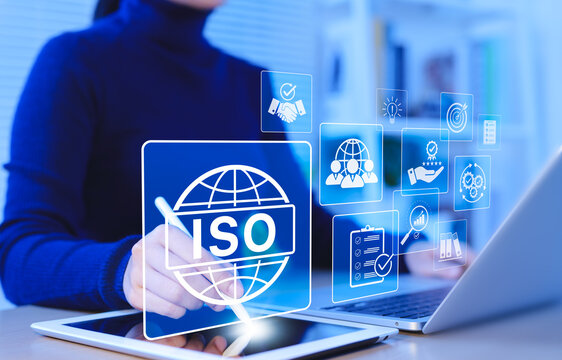 ISO Certification and quality management concept. Businesswoman uses tablet and laptop with ISO certification icons, international standards, compliance, quality management systems, certificate,