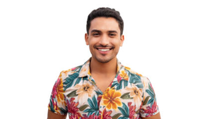 a cheerful man in a floral shirt smiling and looking directly at the camera
