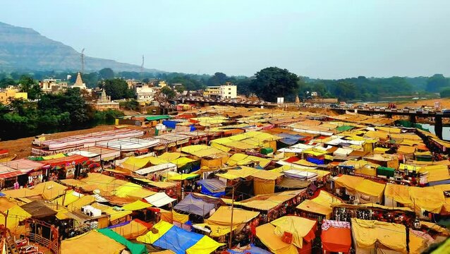 Aerial view of a Jatra or Mela festival at Khandoba Temple, Pali, Satara, India. The fairground is filled with numerous tents for toy and food shops. 