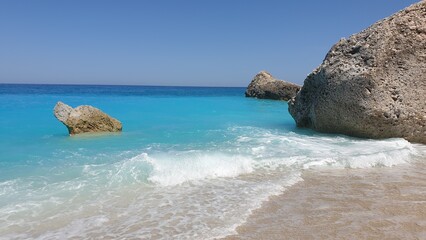 Turquoise Waves Crashing on Sandy Beach with Rocks, Lefkada, Ionian Islands, Greece
