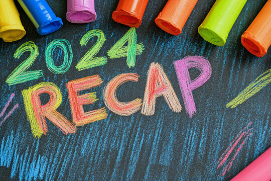 2024 recap. The inscription is made with multi-colored crayons or pencils on black background.