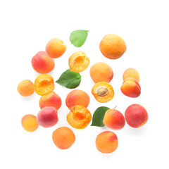Flying apricots with leaves isolated on white background