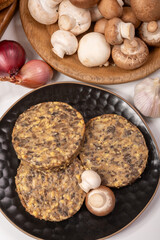 Tasty organic vegetarian food, burgers with champignons mushrooms, cheese and onion