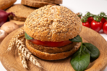 Make burger buns with vegan or vegetarian patties or burgers made from grains, vital wheat gluten food, grilled healthy food