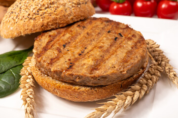 Make burger buns with vegan or vegetarian patties or burgers made from grains, vital wheat gluten food, grilled healthy food