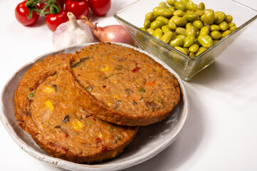 Round vegetarian patties or burgers made from grains, soybeans, vegetables and legumes
