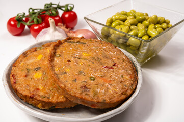 Round vegetarian patties or burgers made from grains, soybeans, vegetables and legumes