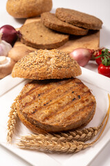 Make burger buns with vegan or vegetarian patties or burgers made from grains, vital wheat gluten food, grilled healthy food