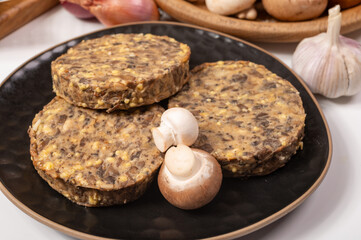 Tasty organic vegetarian food, burgers with champignons mushrooms, cheese and onion