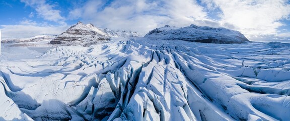 Aerial view of glacier from above, ice texture landscape, beautiful nature blue background from Vatnajokull, Iceland.
White and blue ice texture. Melting glaciers, global warming. Sunny day 