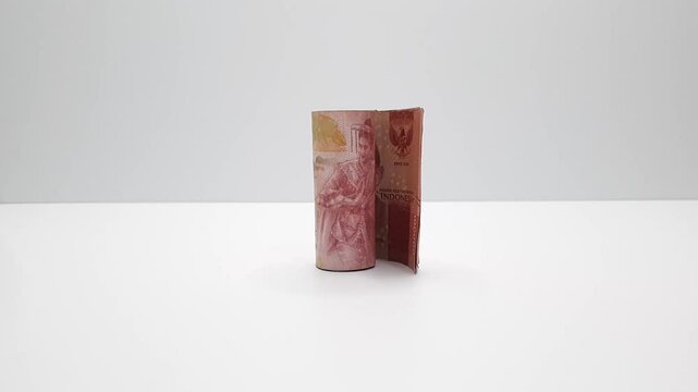 Rolled Stack Indonesian Rupiah Banknotes Cylindrical Shape Vertical Open Placed Center White Dim Background Dramatic Lighting Representing Hidden Fees Costs Financial Transaction Economy Cash Payment