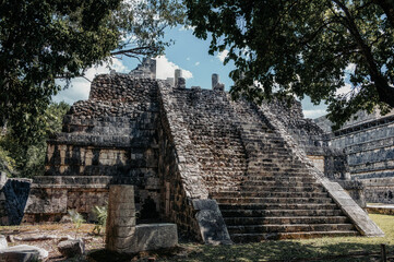 Small mayan pyramid in the forest, Chichen Itza archaeological site.