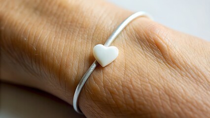 close up of human hand with stethoscope on a white background