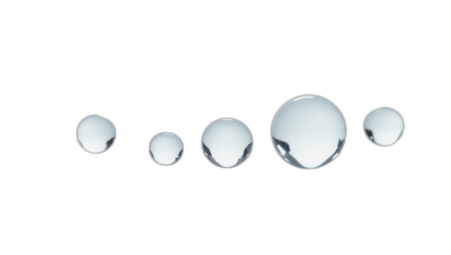 Delicate spherical transparent water drops of varying