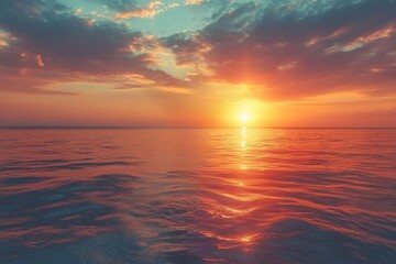 Obraz premium Bright sunset over the ocean with clouds.