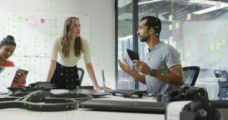 Diverse team discussing technology with binary code animation over office scene - Powered by Adobe