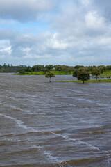Monte Novo Dam at its maximum water level, supplying Évora, Alentejo, Portugal. A serene landscape reflecting the abundance of water in the region.